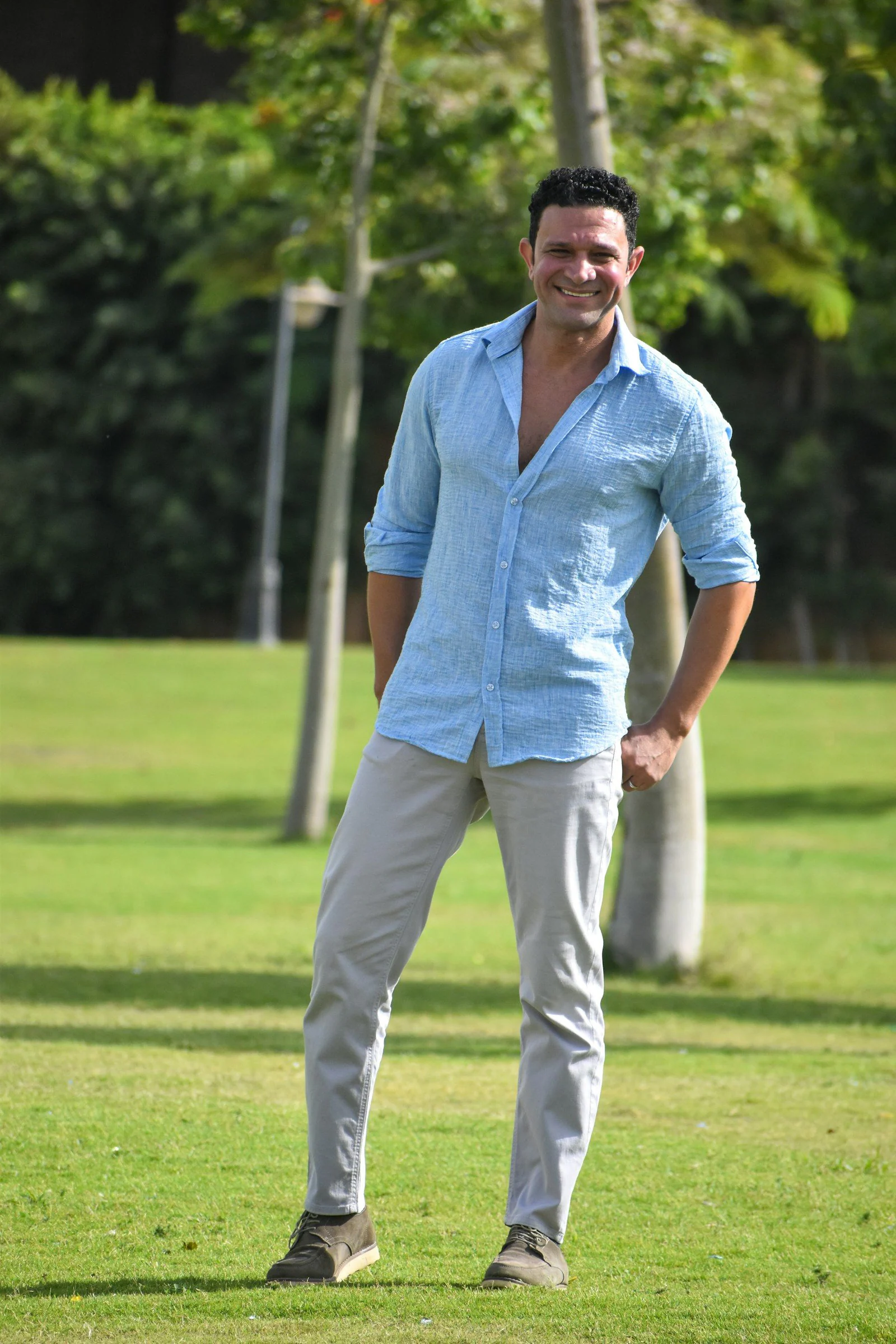 Man in blue shirt in park