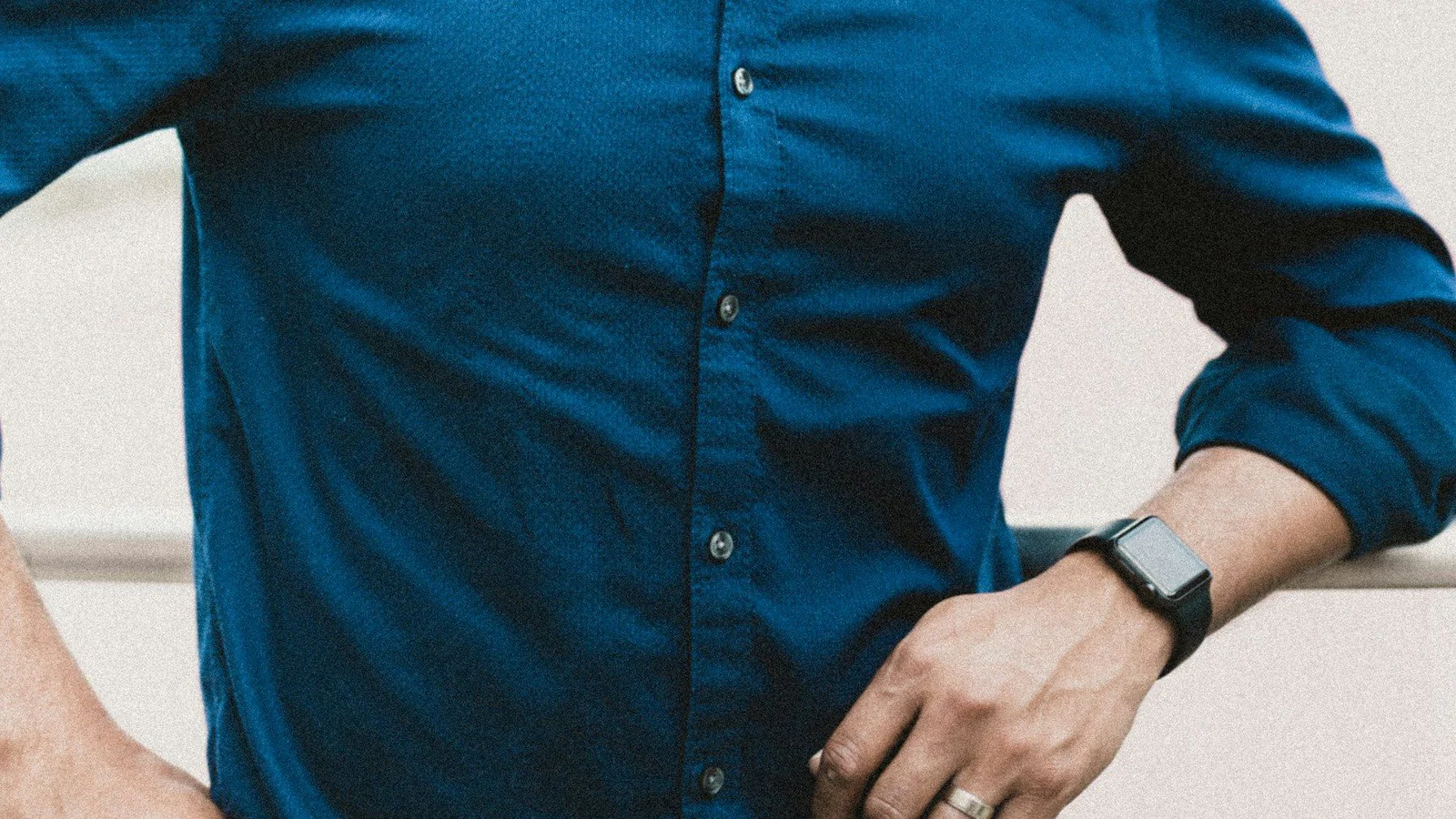 Person in blue button up long sleeve shirt