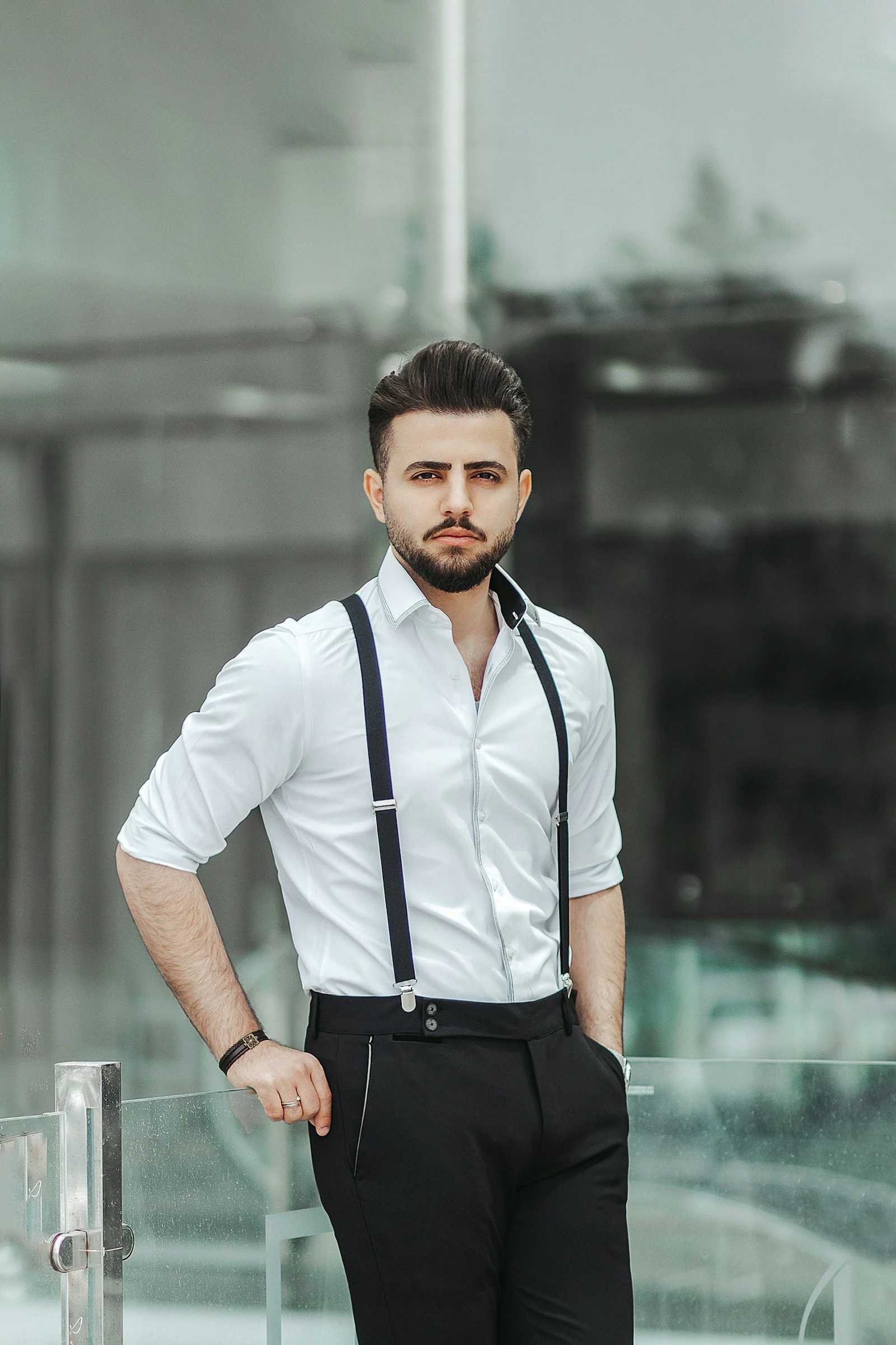 Man in white shirt and suspenders