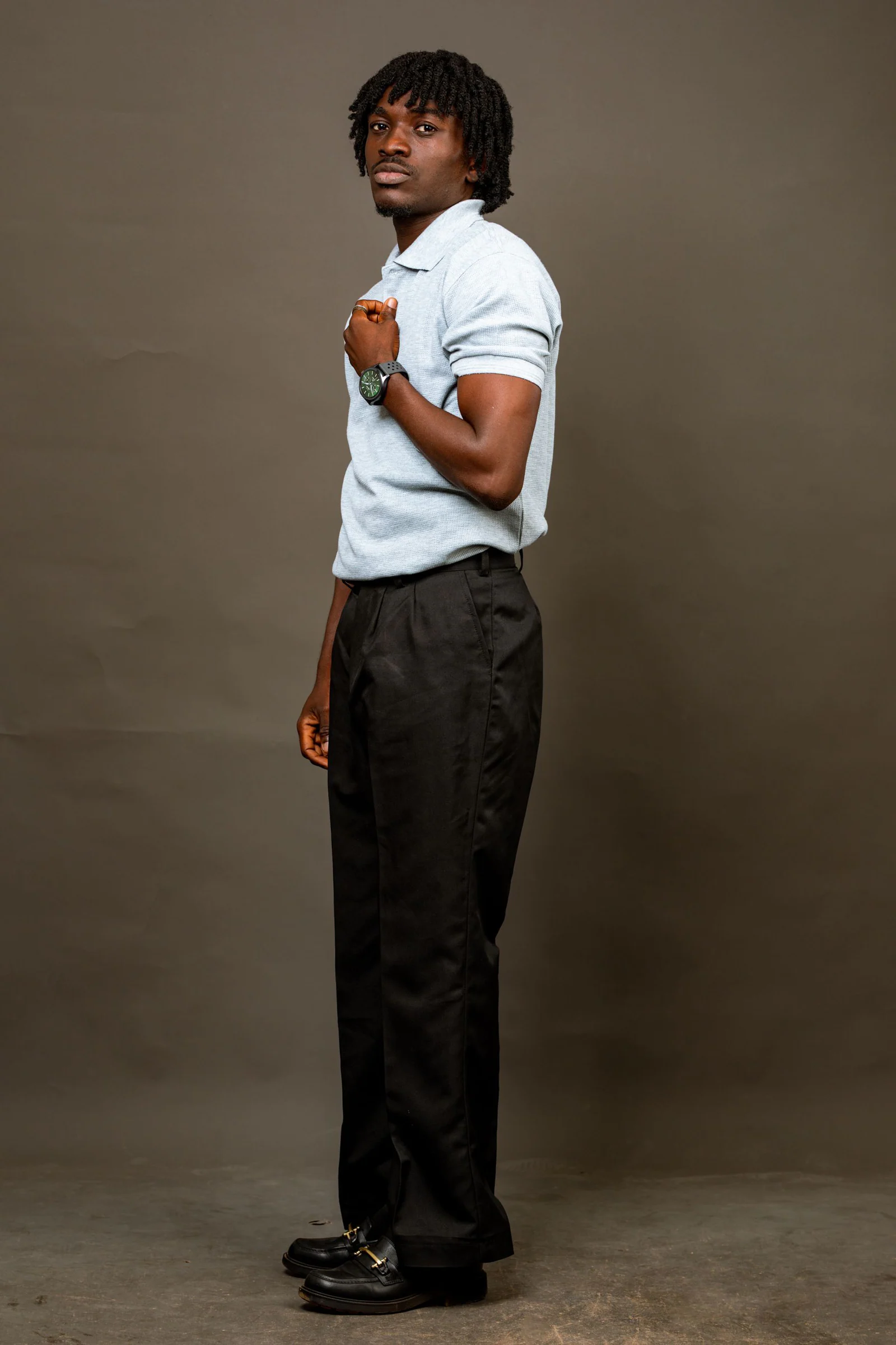 Portrait of a stylish young man in accra studio