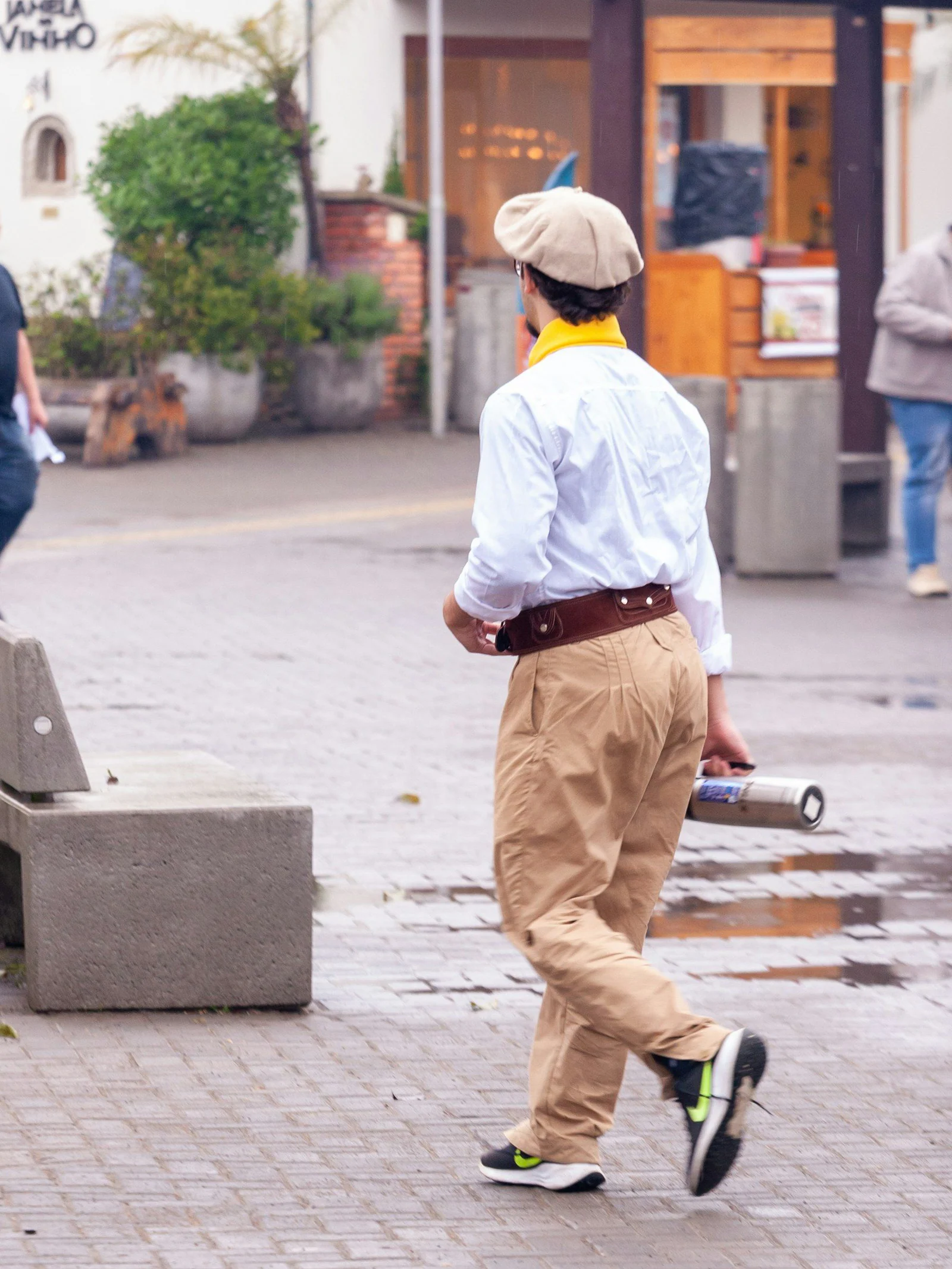 Person in white shirt and trousers