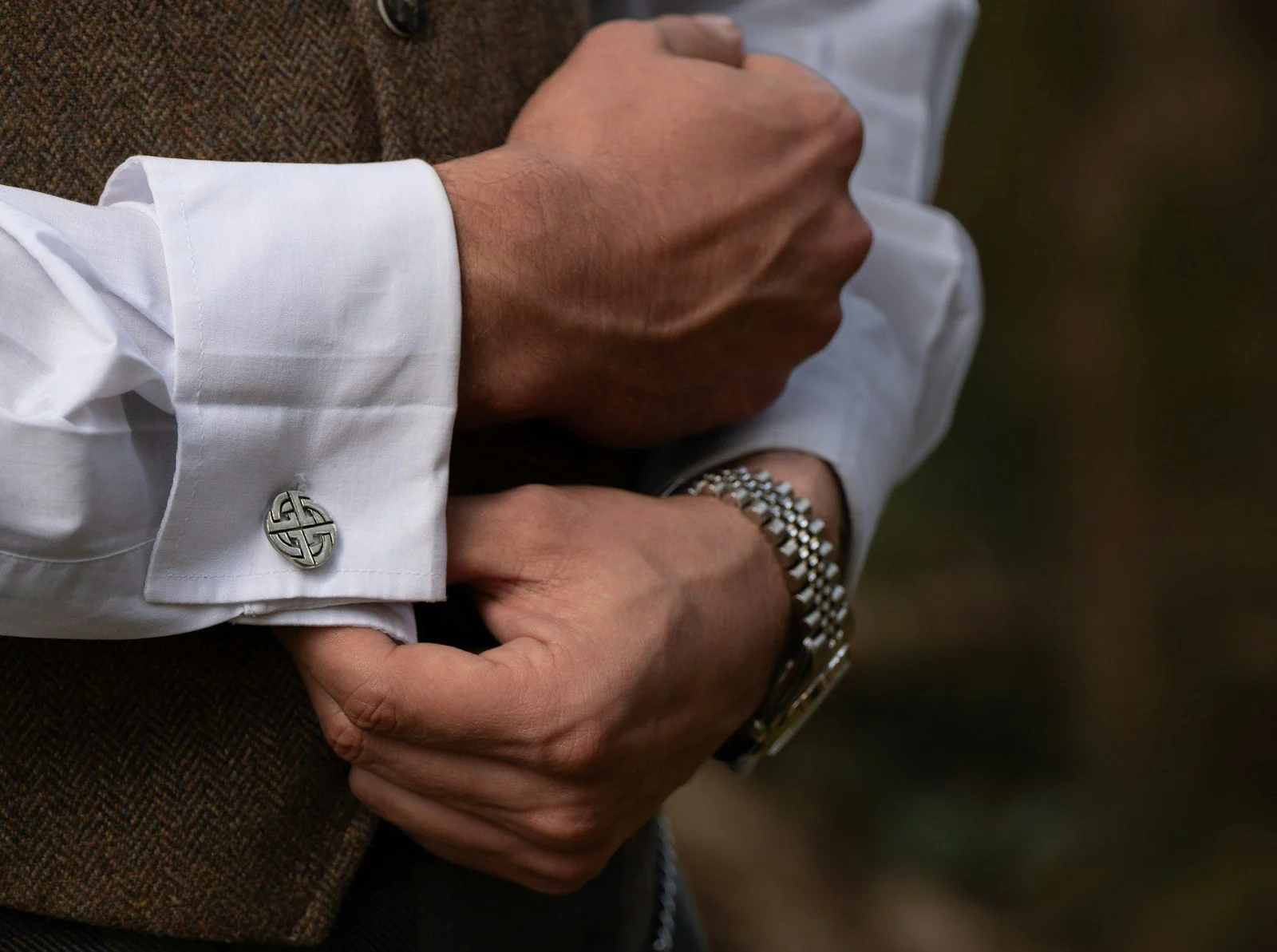 Man adjusts his cuff links