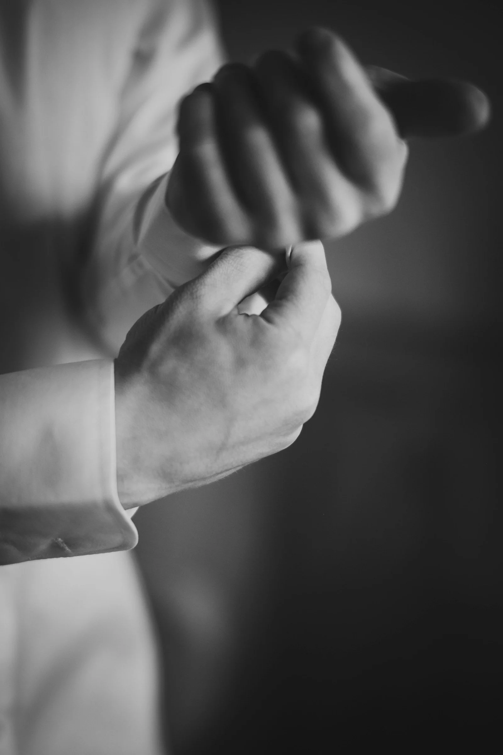 A black and white photo of a person holding something