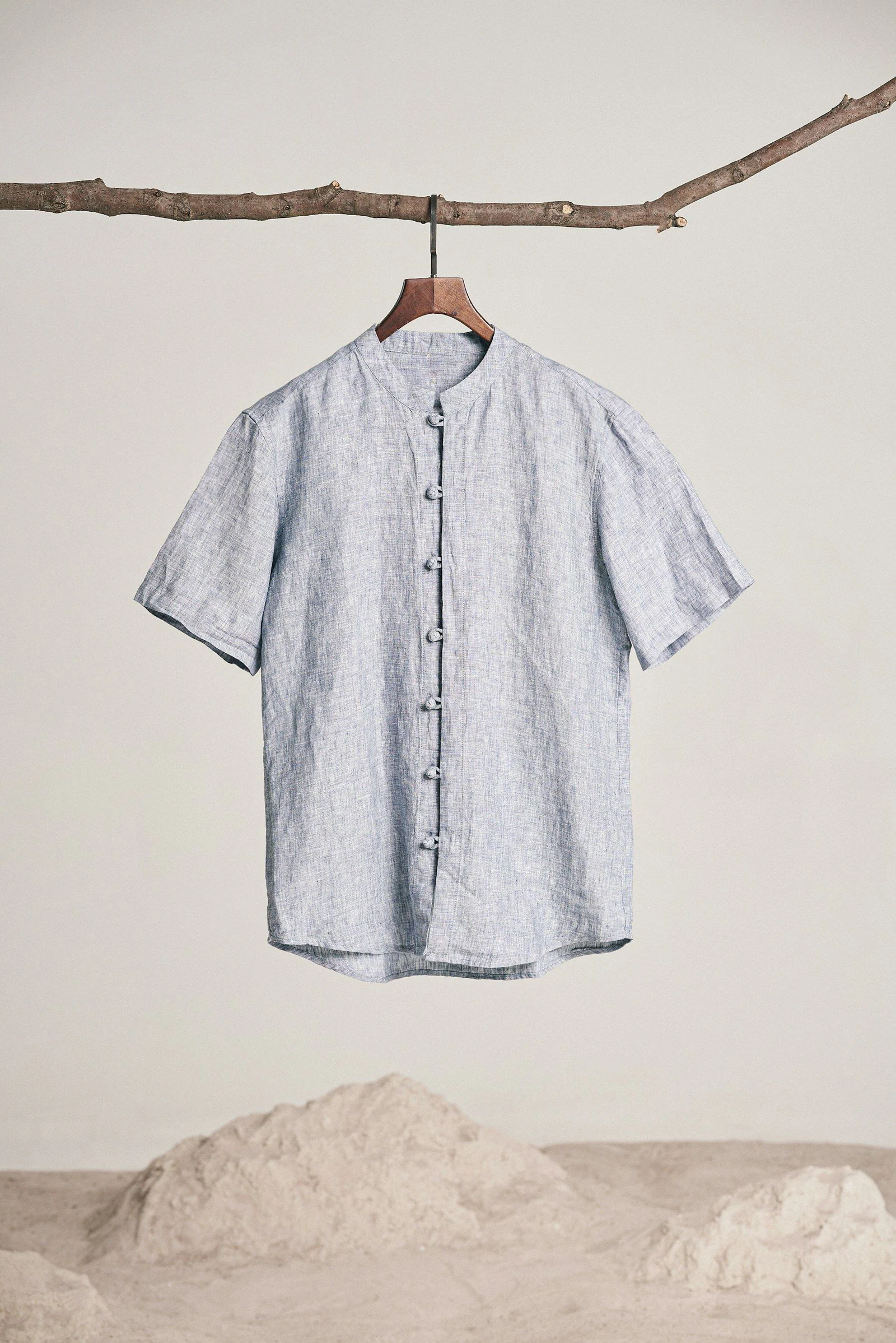 A blue shirt hanging on a clothes line