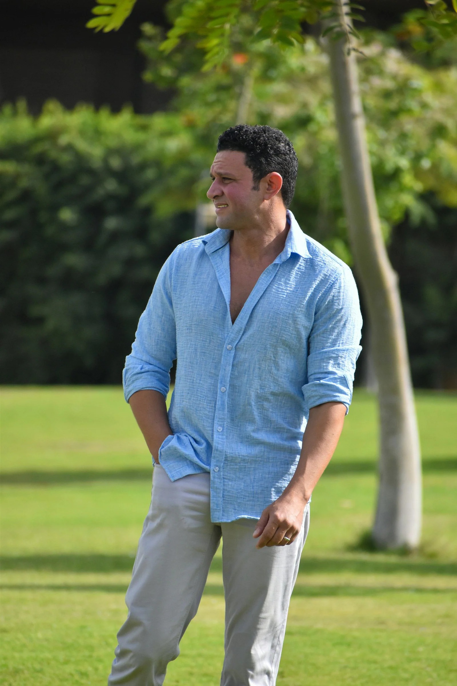 Man in blue shirt in park
