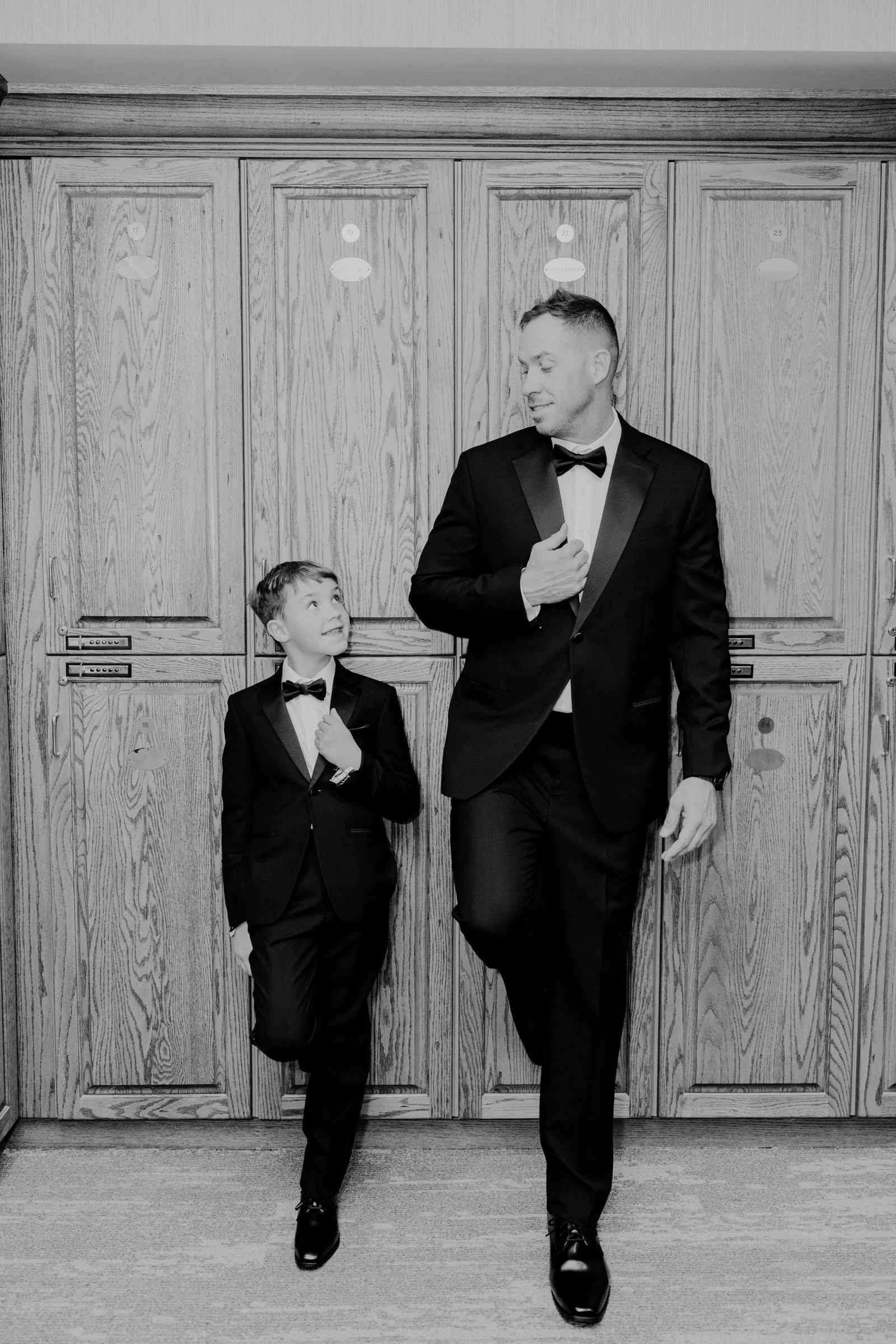 Elegant father and son in matching suits