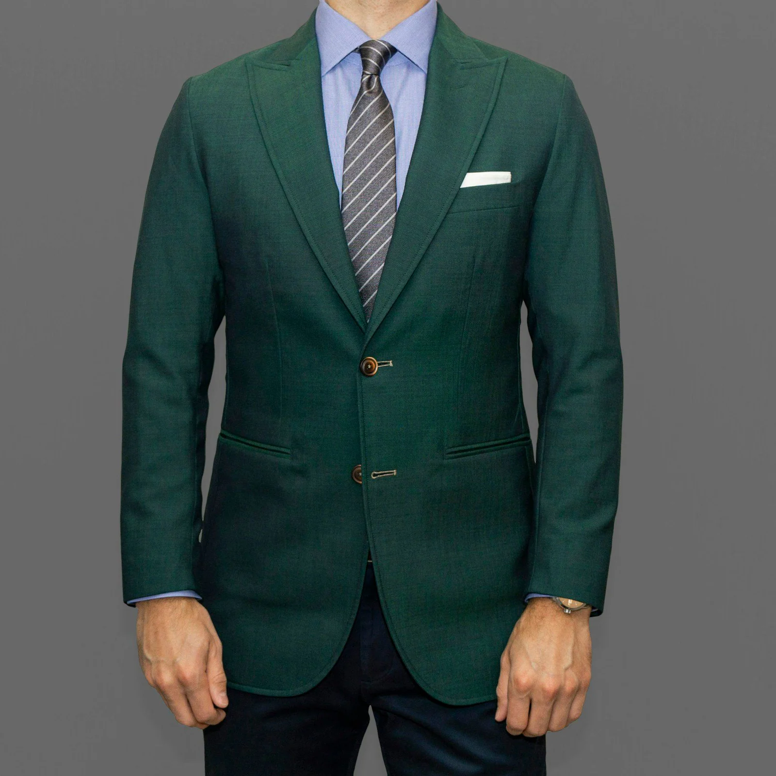 Man in blue suit jacket and black pants
