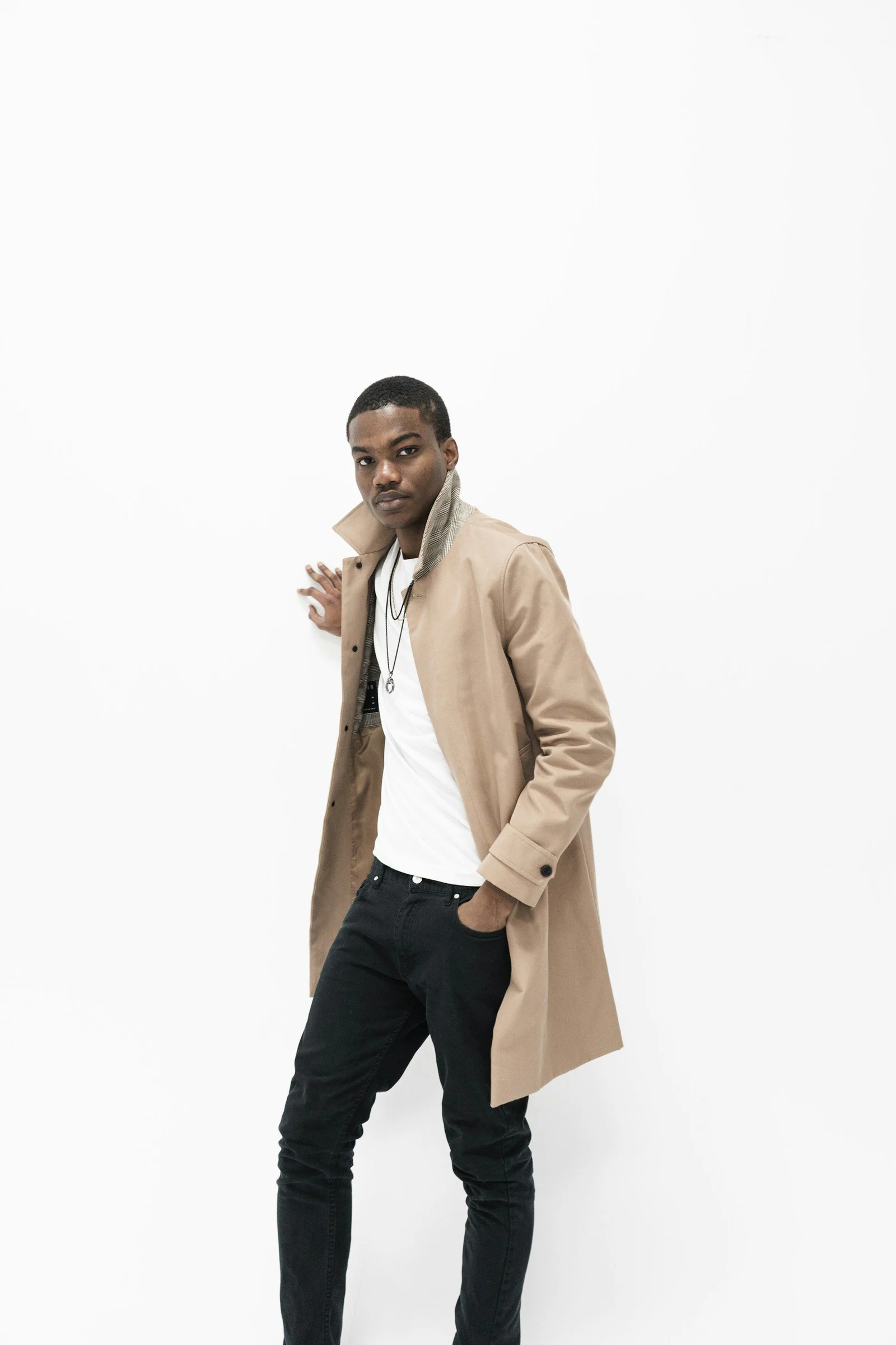Man wearing beige coat