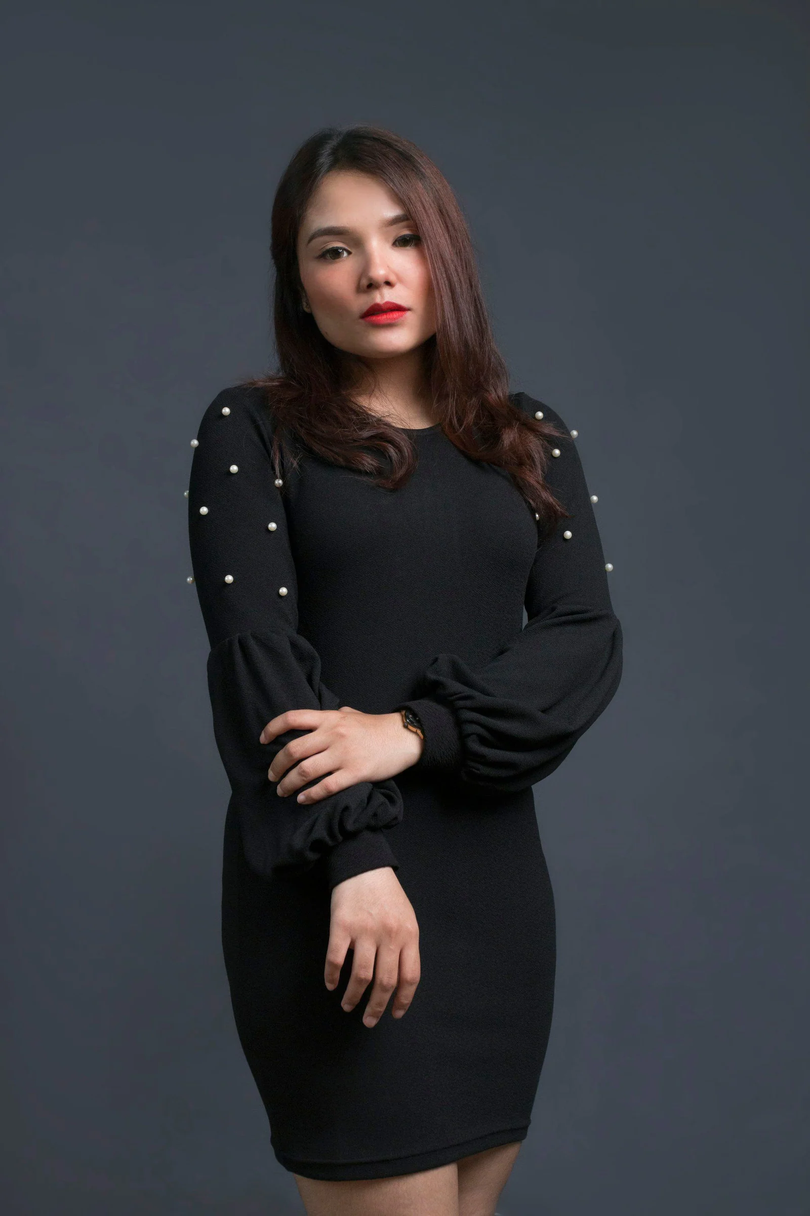 Woman in black long sleeve dress