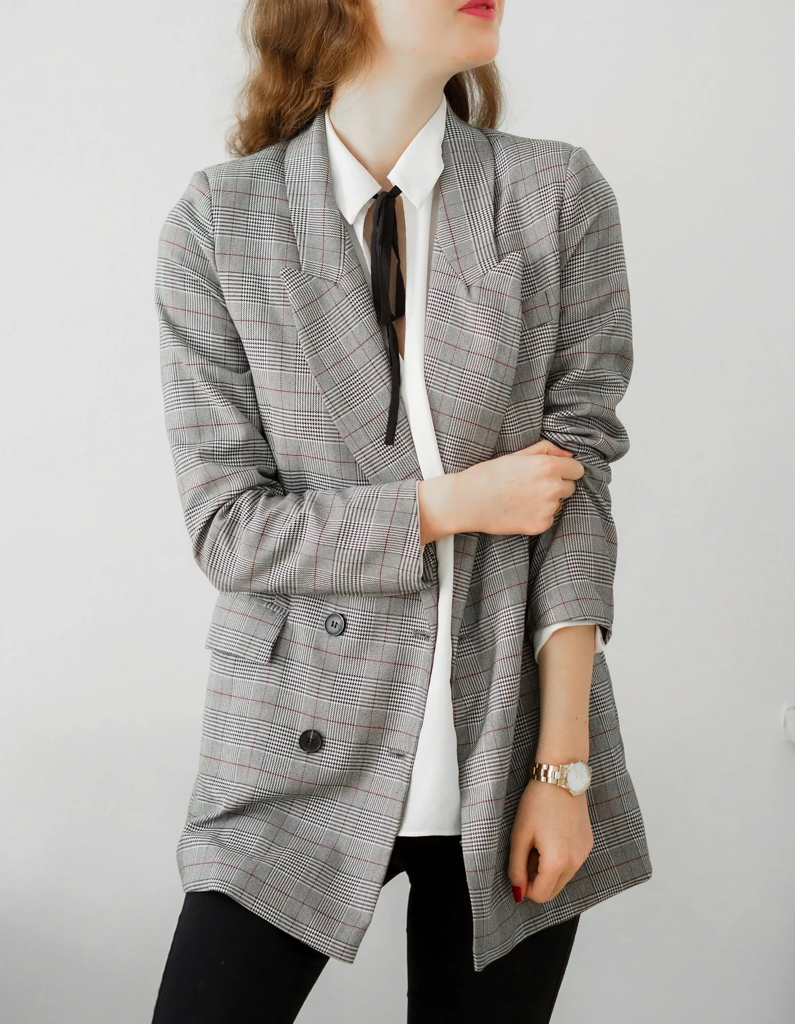Woman in gray blazer and black pants