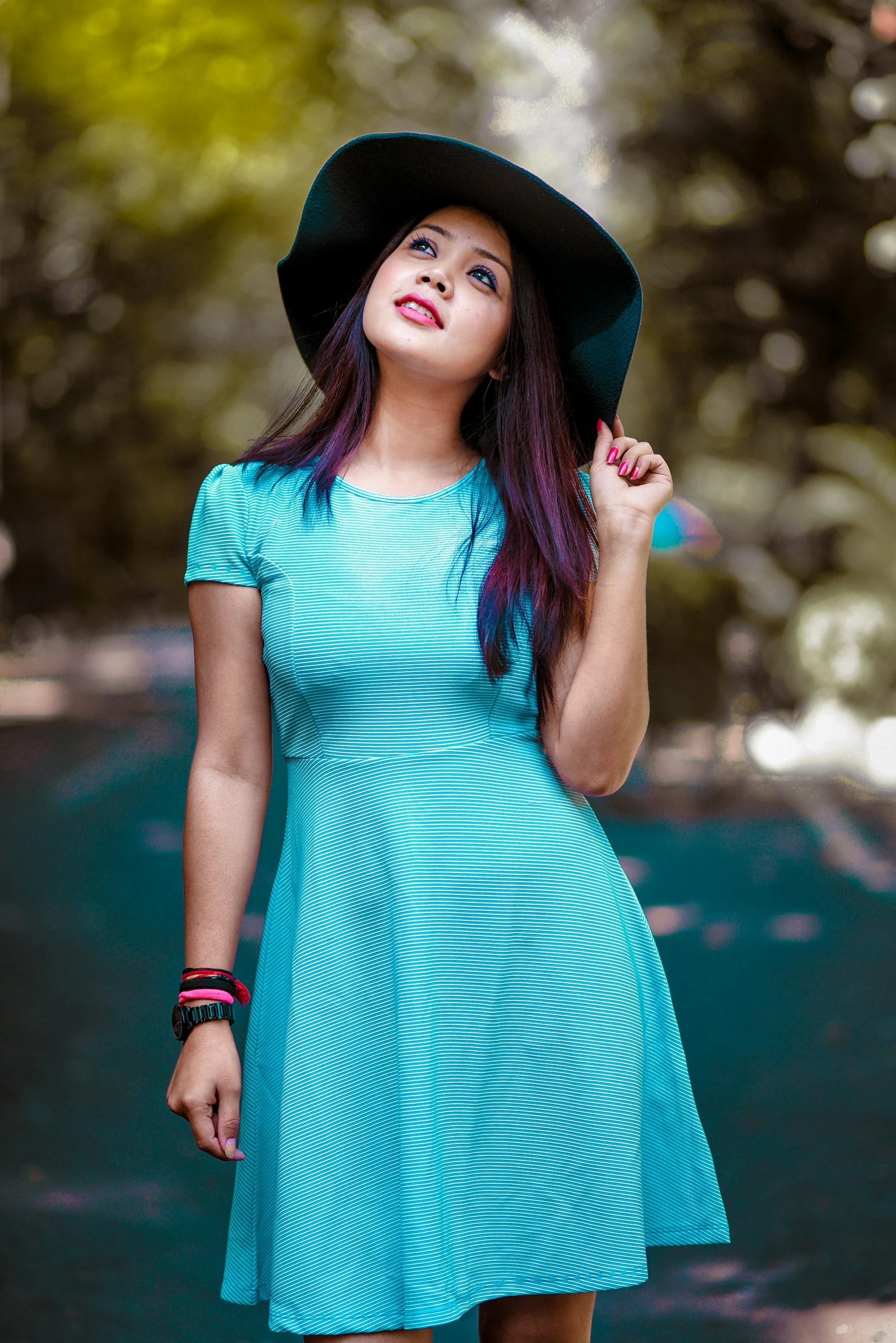 Woman looking upwards during day