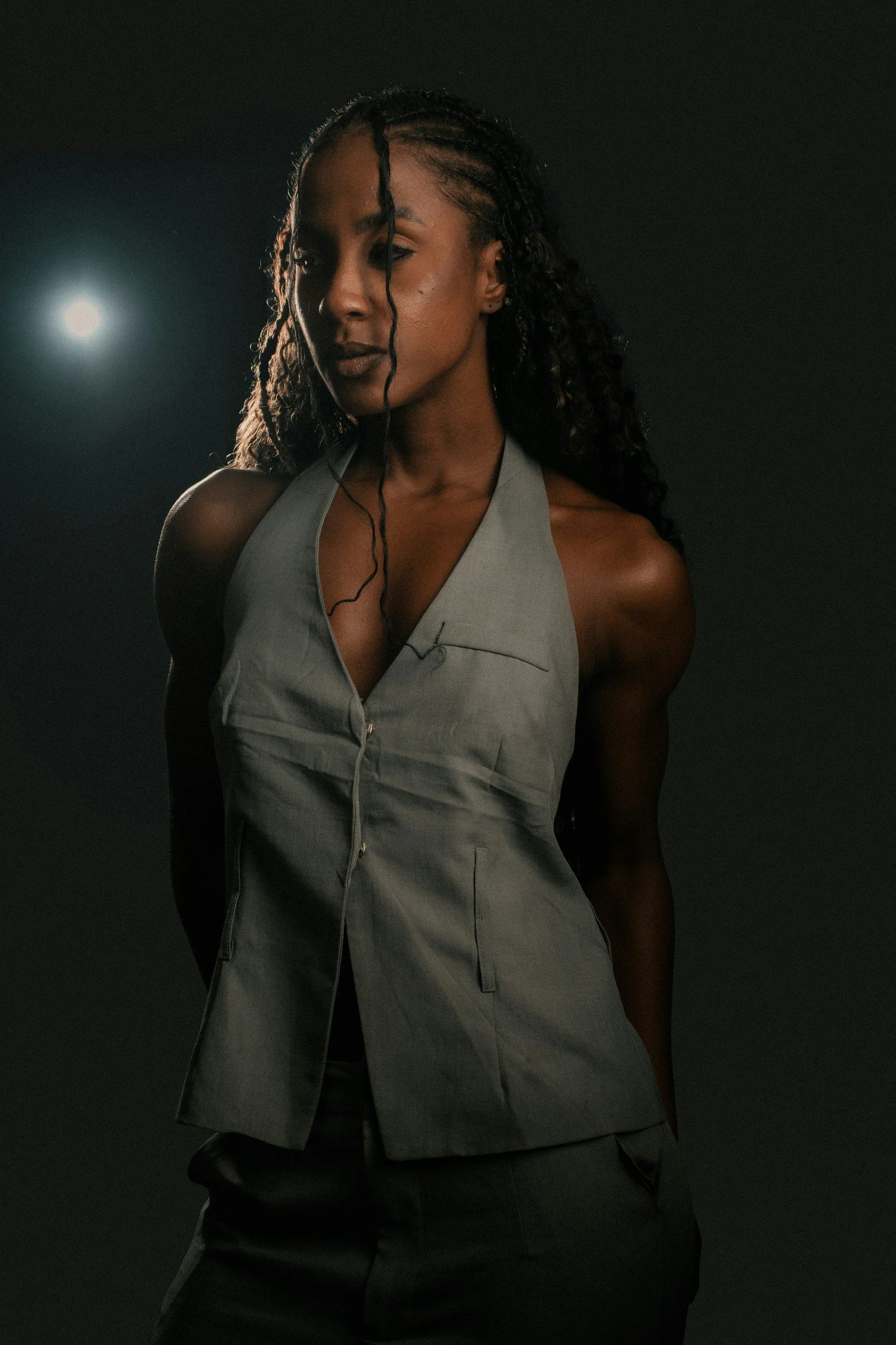 Woman in grey vest