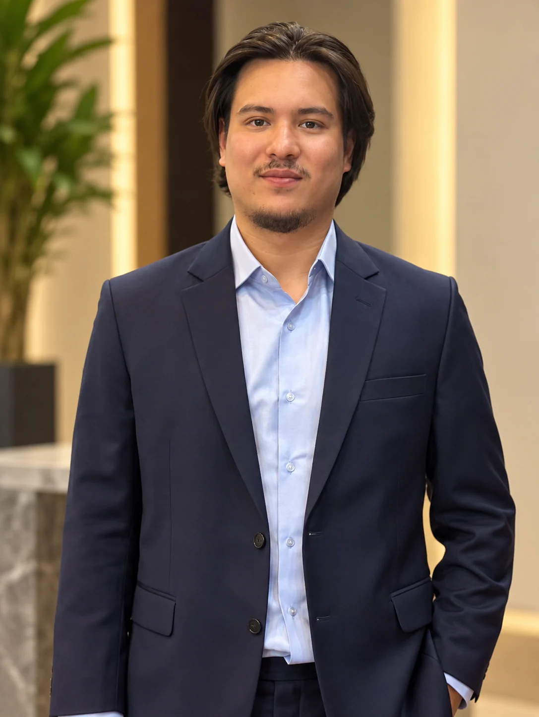Navy suit with light blue shirt and no tie