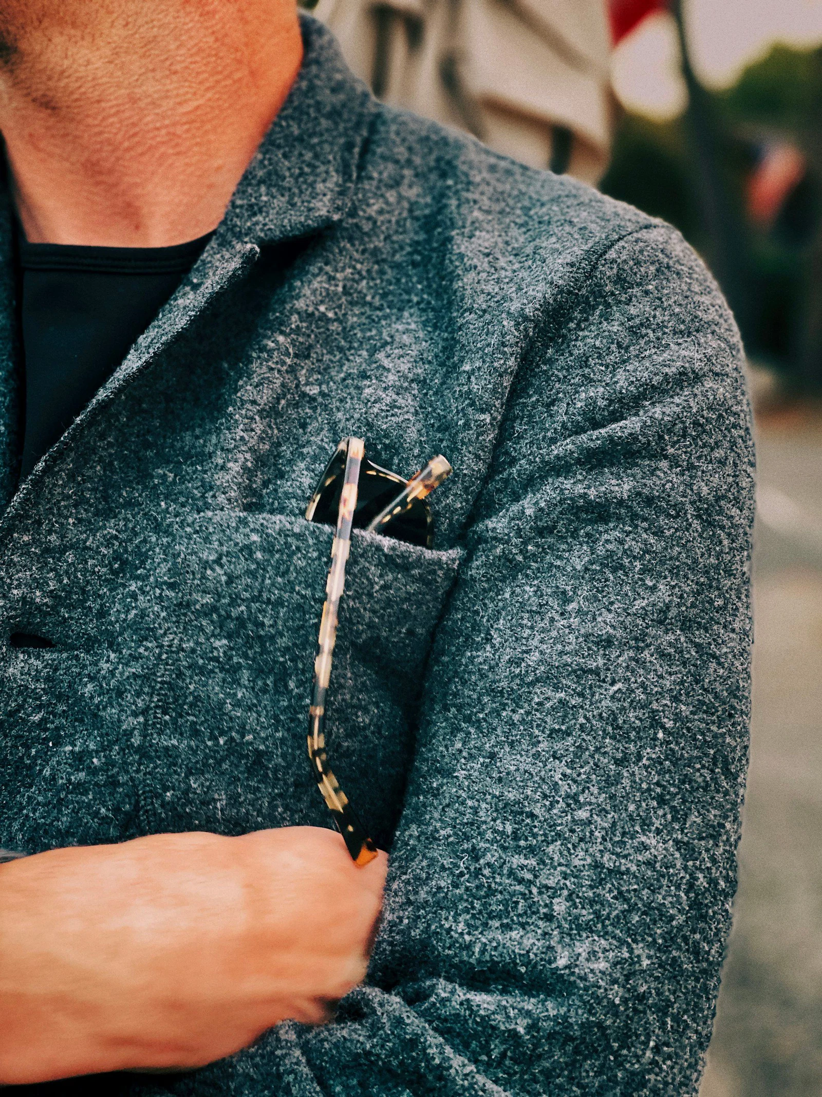 Textured green wool jacket with a breast-pocket detail