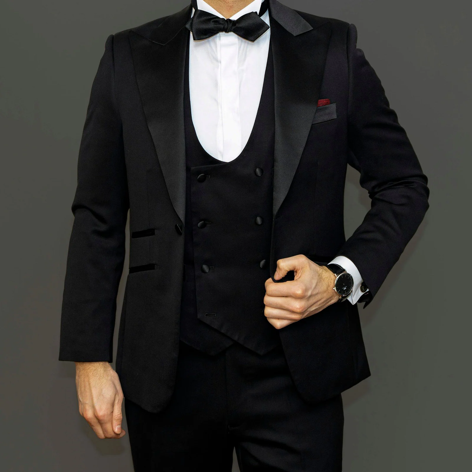 Black dinner suit with shawl lapels, waistcoat and bow tie