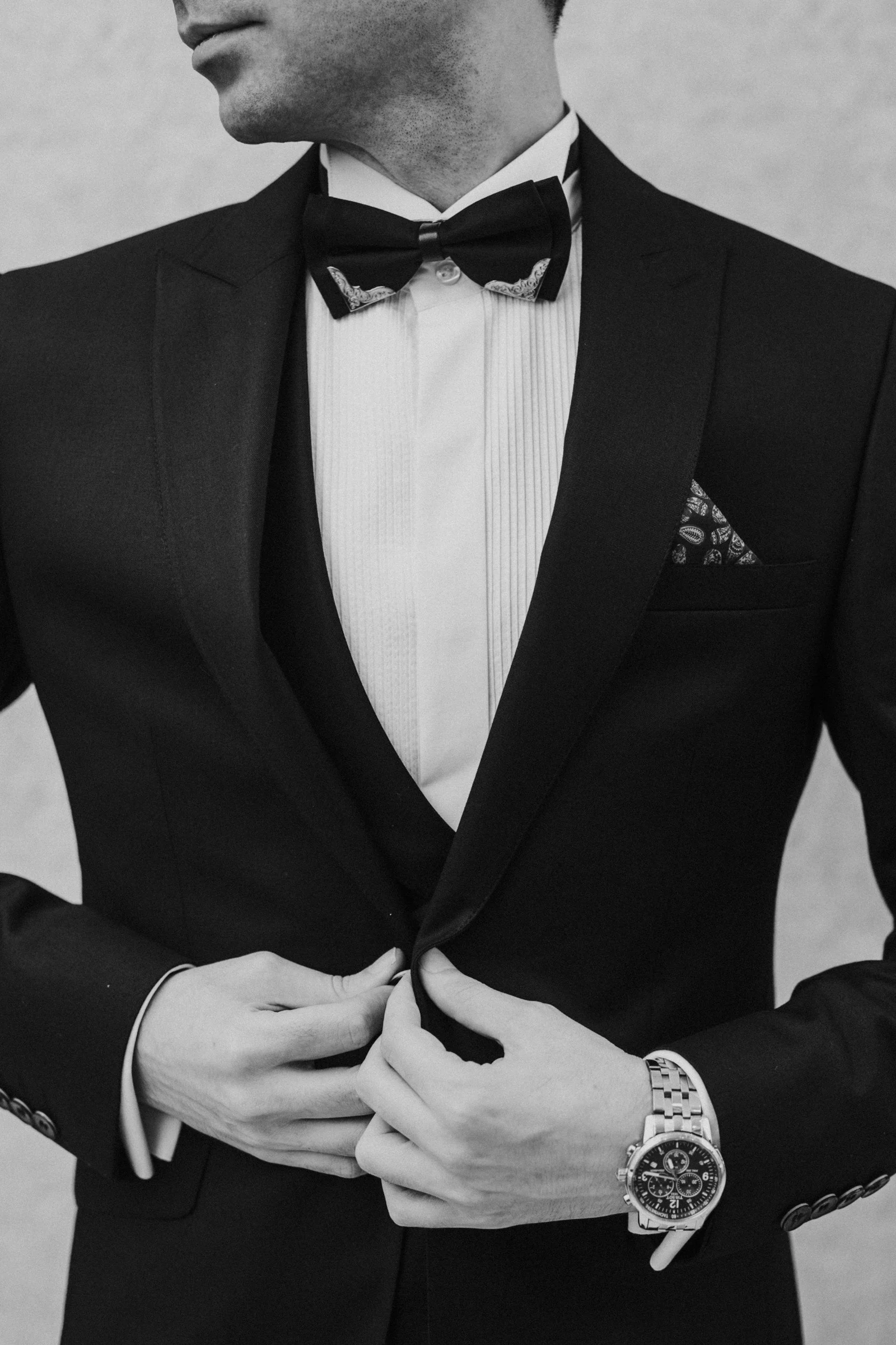 Black dinner suit with satin lapels, black and white portrait